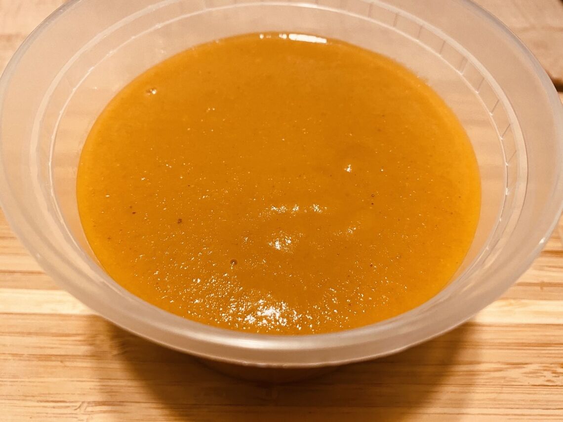 A dish of orange sauce