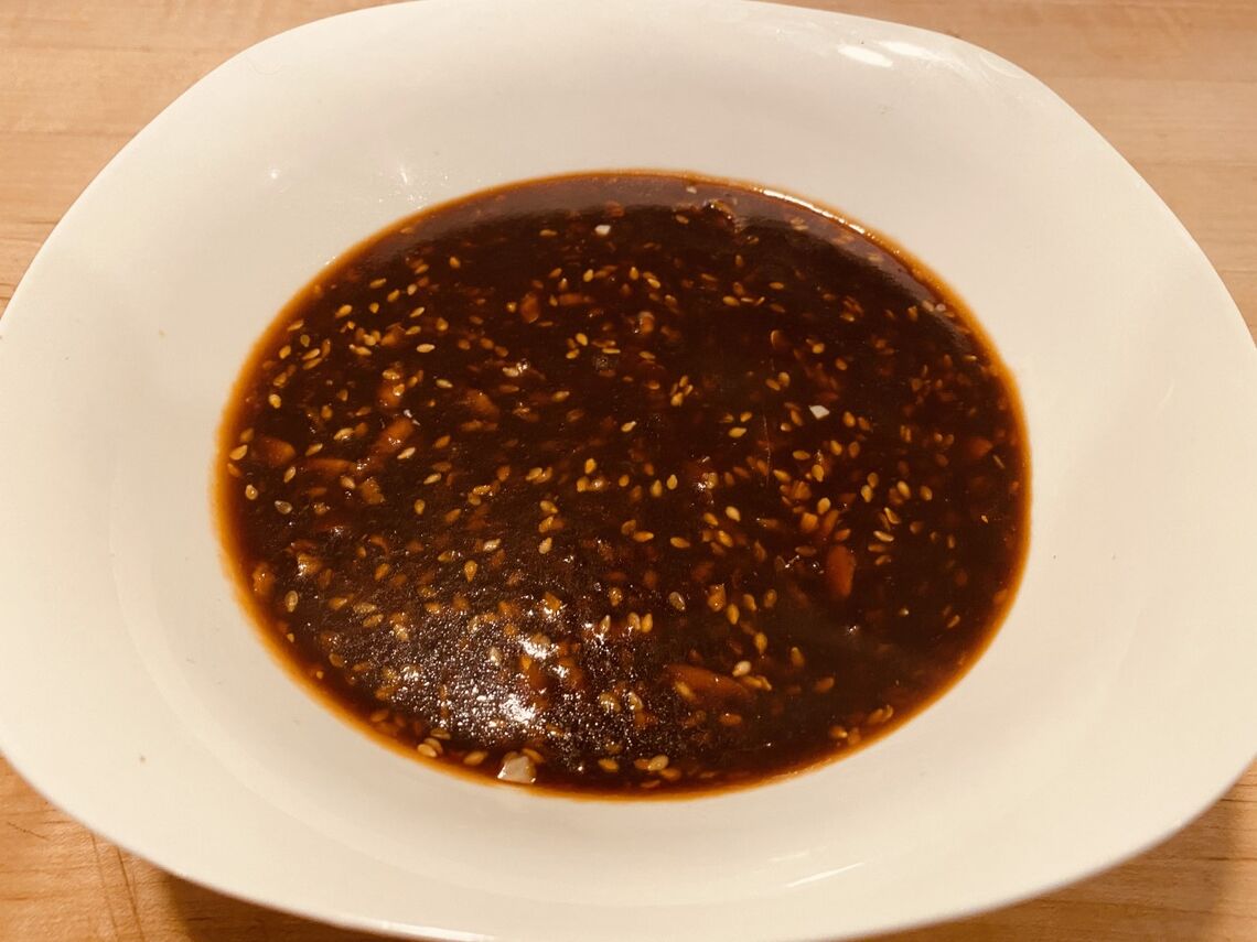 a syrupy looking dark brown sauce