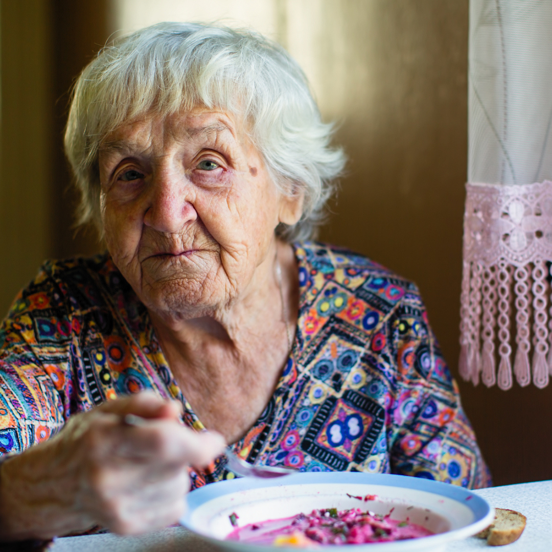 senior women eating cereal